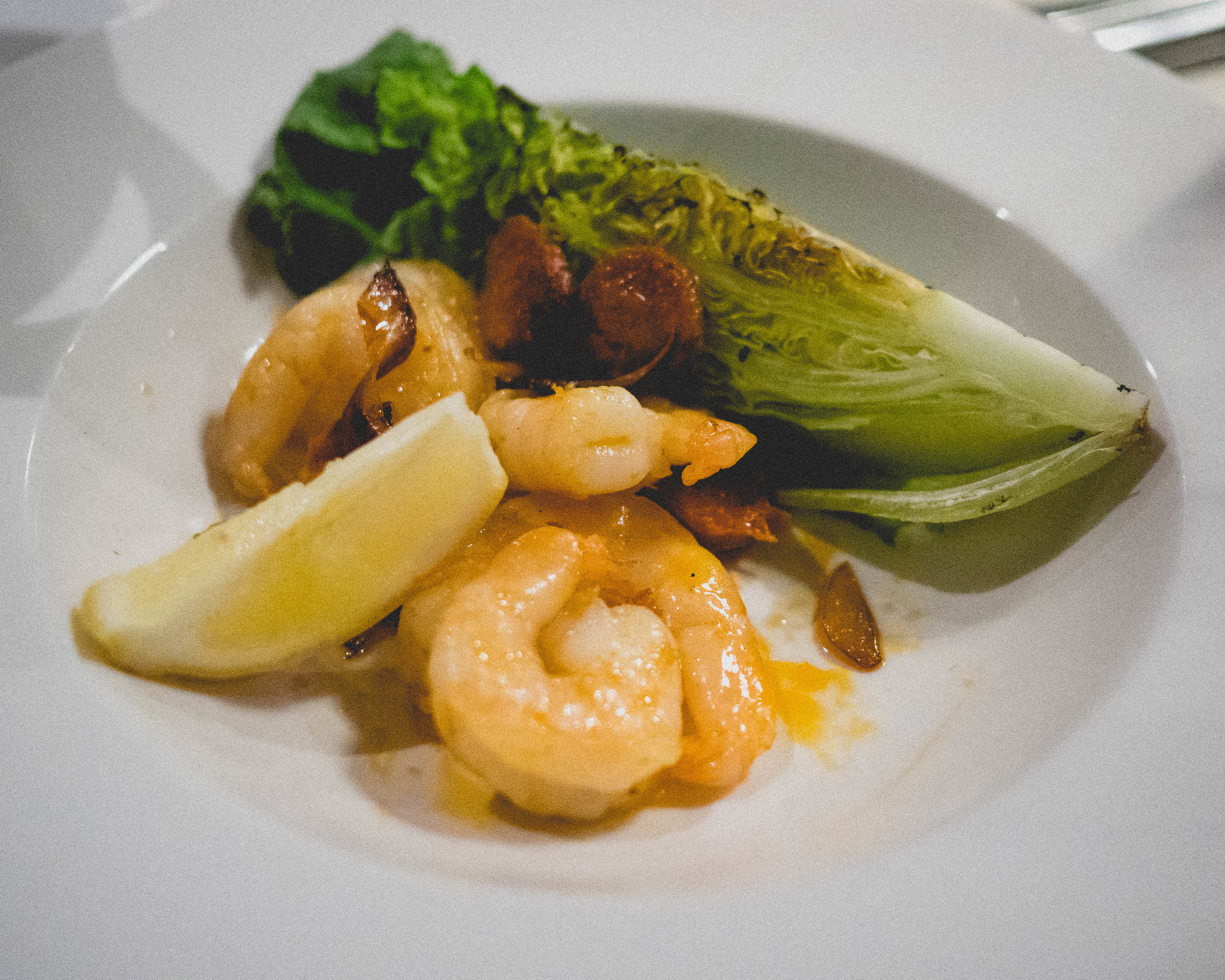 sauteed tiger prawns, spicy chorizo sausage, sliced red onion, charred baby gem lettuce.
