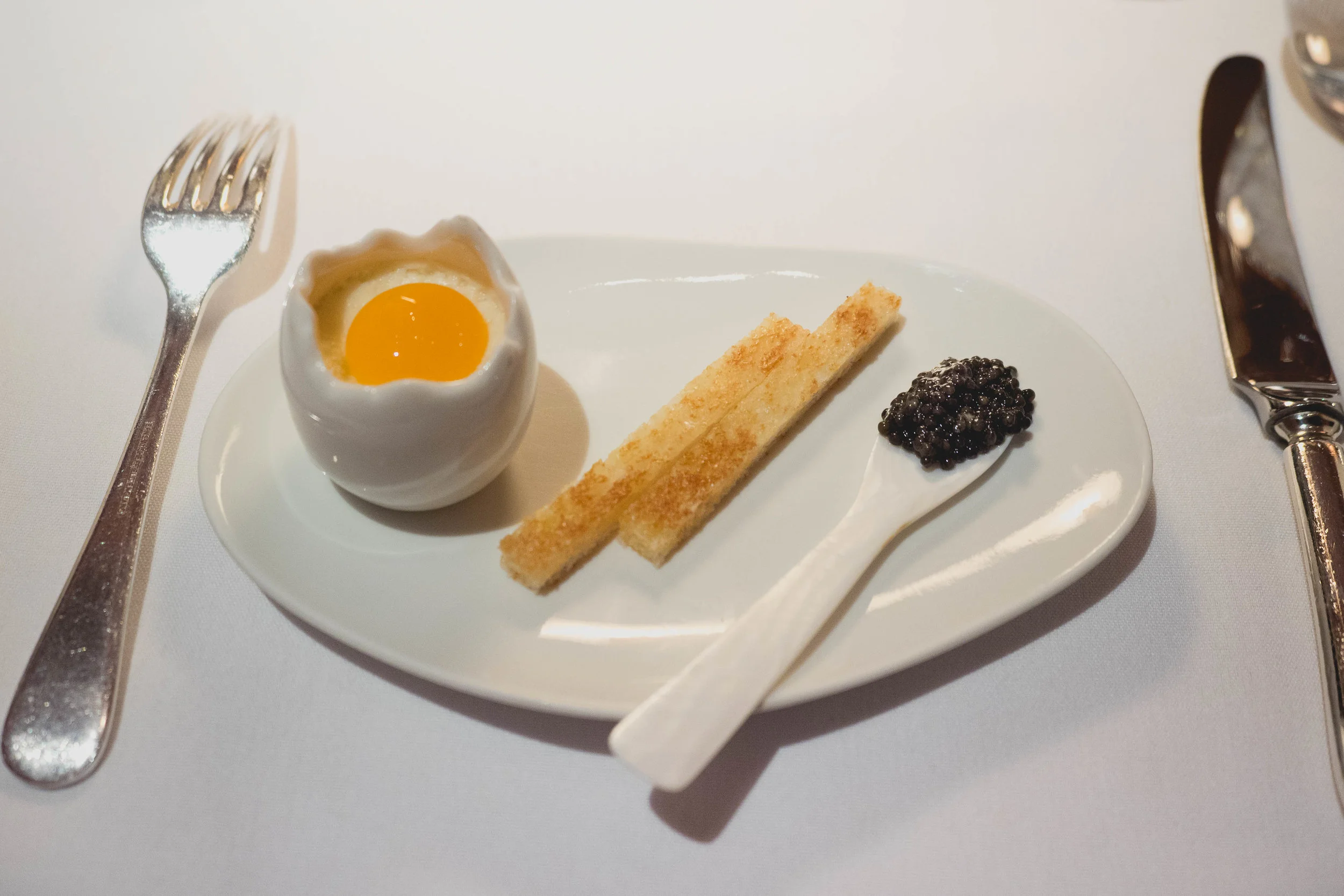 eggs and soldiers : comte cheese mornay, 63 degree egg yolk, comte cheese soldiers, sturgeon caviar.