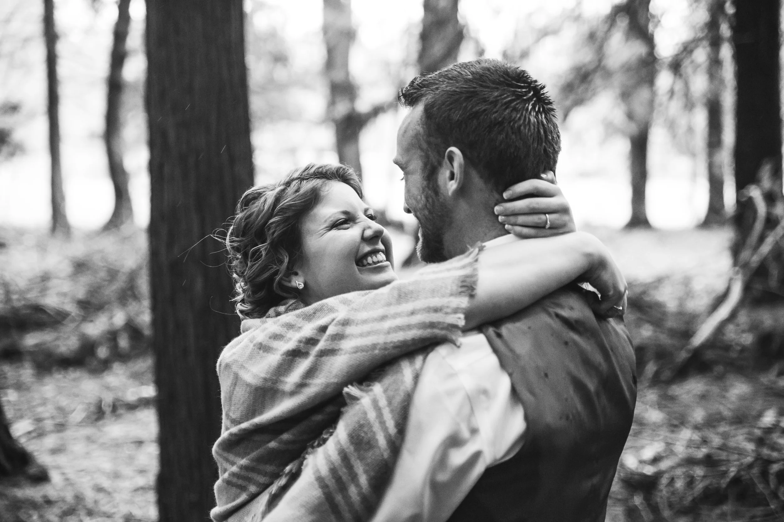 A emotional first look A rainy forest wedding in Lynden Washington, featuring teal blue accents, rustic details, umbrellas and a large bridal party.#rain #wedding #lynden #washington #umbrella #spring #teal #grey #brown #trees #romantic #documentarywedding #unposed #romanticposes #couple #largebridalparty Photography by Christina Voorhorst of Mimsical Photography. Do not alter, crop, edit or share these images without proper credit or permission. www.mimsicalphotography.com 