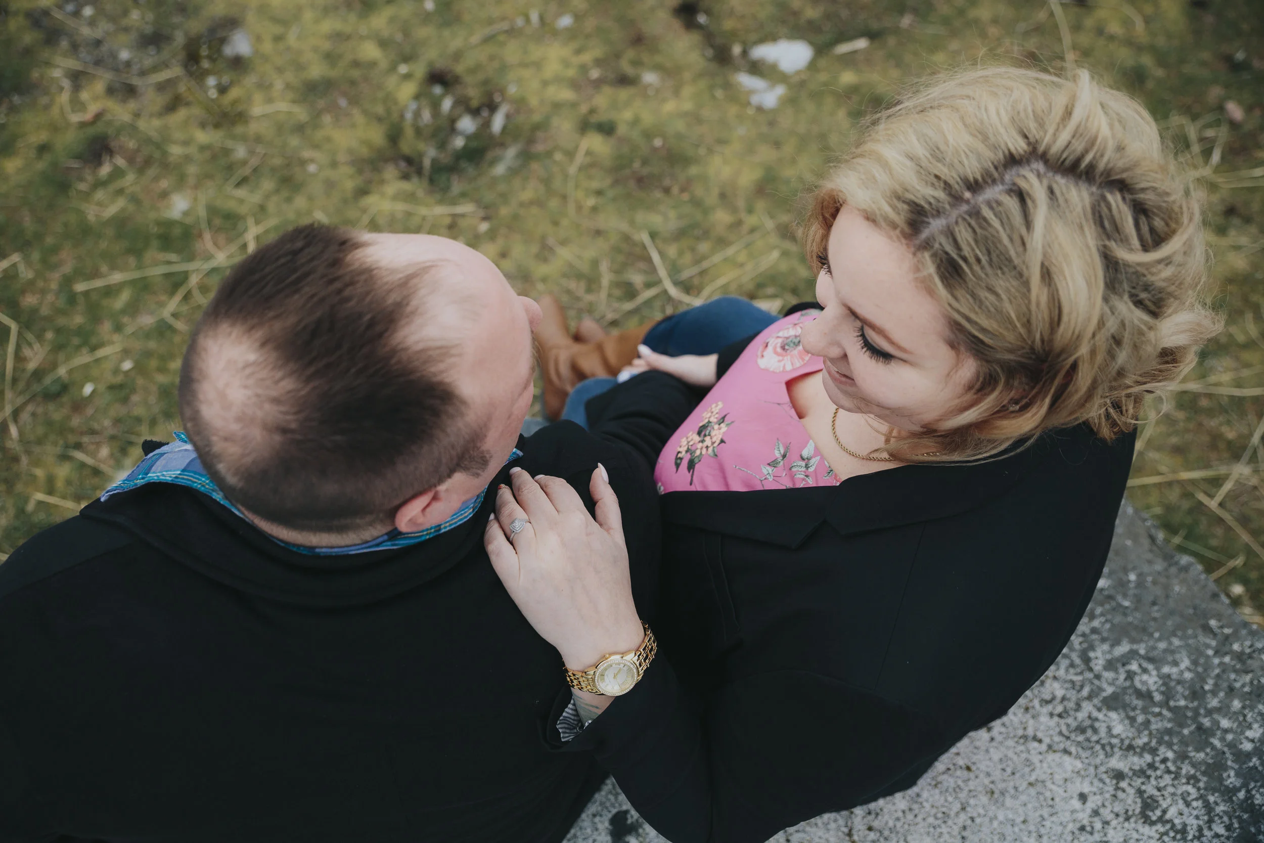 Cloudy engagement session at Garry Point Park in Richmond, BC. Looking down on couple. Ring shot Photography by Christina Voorhorst of Mimsical Photography #westcoastphotographer #engagement #ring #couple #ocean #cloud #overcast #romantic #poses