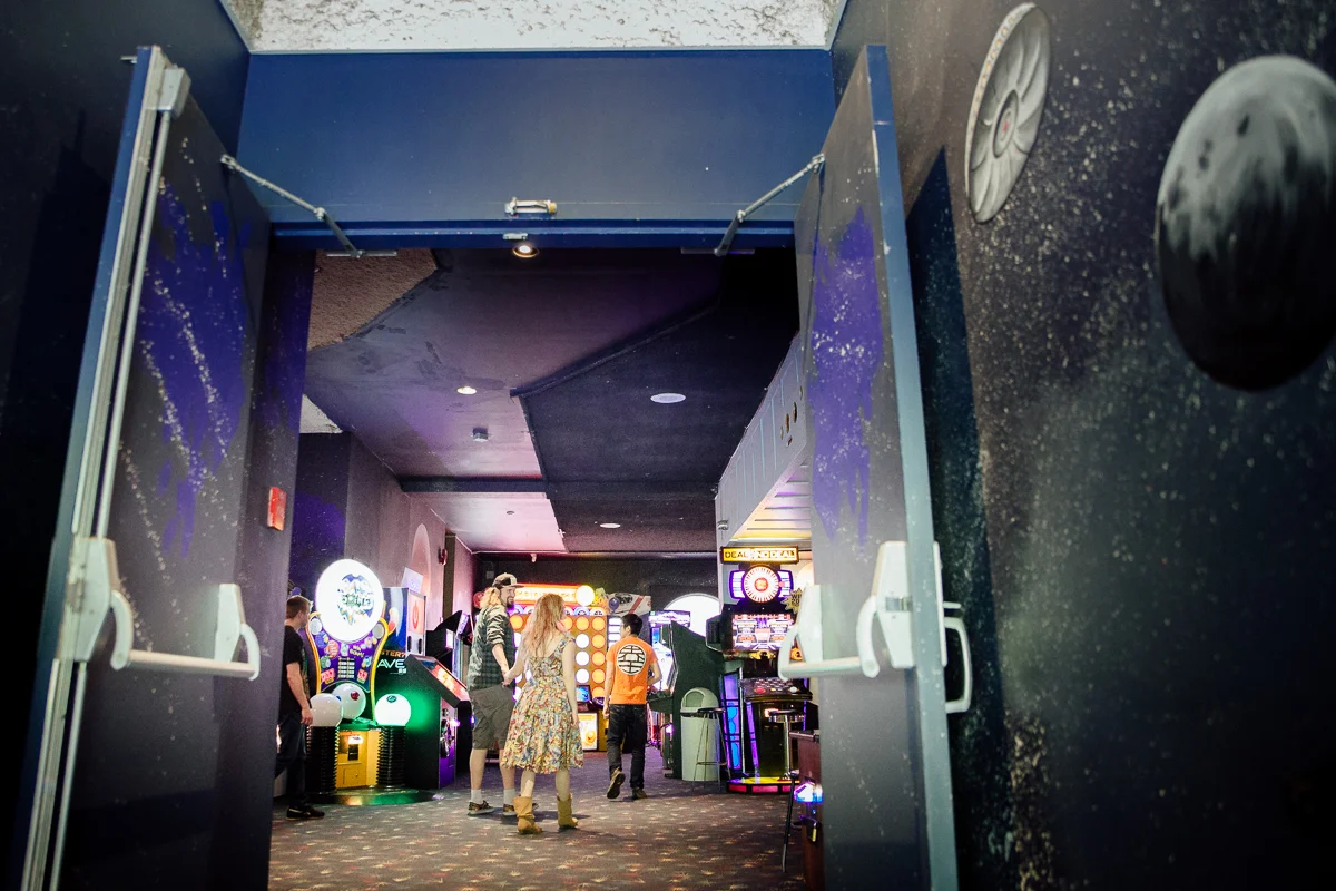 Visiting the arcade inside at Castle Fun Park. Castle Fun Park Documentary Engagement Photography, minigolf date by Mimsical Photography. Real stories about Real Couples that are just as unique as they are. #unique #vibrant #personality #nerd #princess #ecclectic #gamer #couple #minigolf #vancouver #candid #storytelling #connect #datesforcouples #arcade #arcadedate