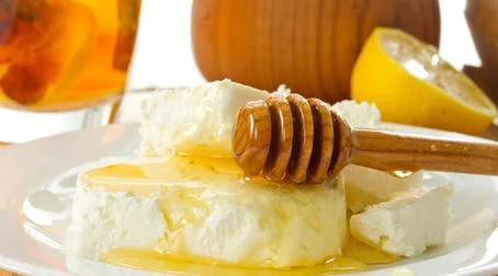 I spread Savannah Bee Company Winter White Honey over Boar's Head Canadian Cheddar Cheese
