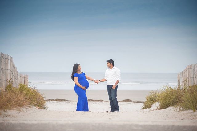 My favorite from a maternity shoot. I saw this beautiful symmetry entering the beach and wanted an environmental shot. I was literally lying on my belly on the road. The beautiful blue dress really pops out and makes them look amazing. Can't wait to 