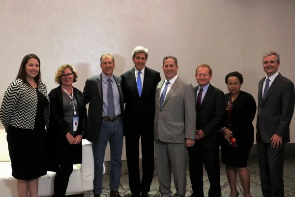 Mike Howard, Smith’s executive vice president for finance and administration (5th from left) with former U.S. Secretary of State John Kerry and other participants at a recent climate action summit.