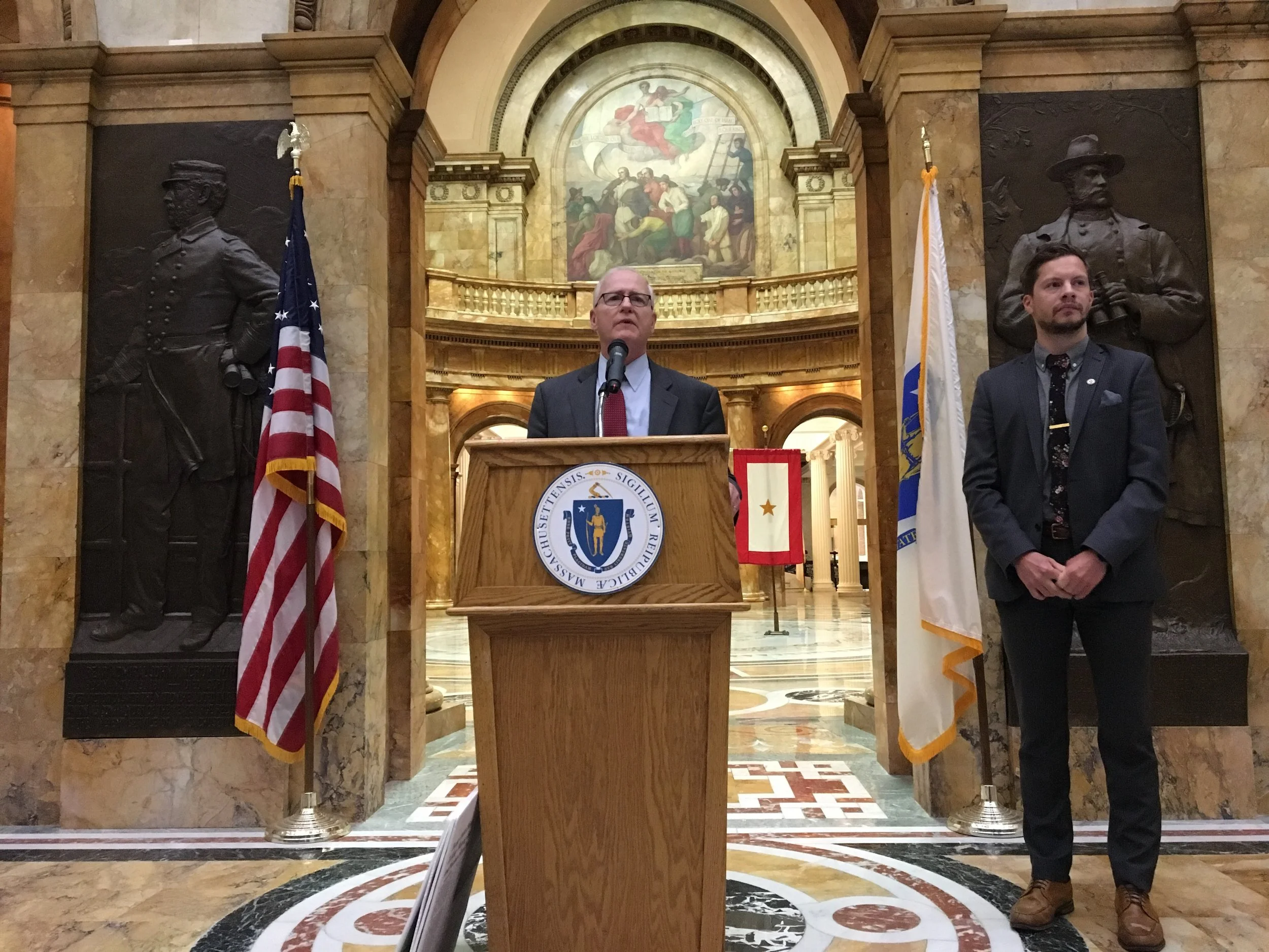 Senator Michael Barrett (D-Third Middlesex) with ClimateXChange Executive Director, Michael Green speaking about carbon pricing at the Massachusetts State House.