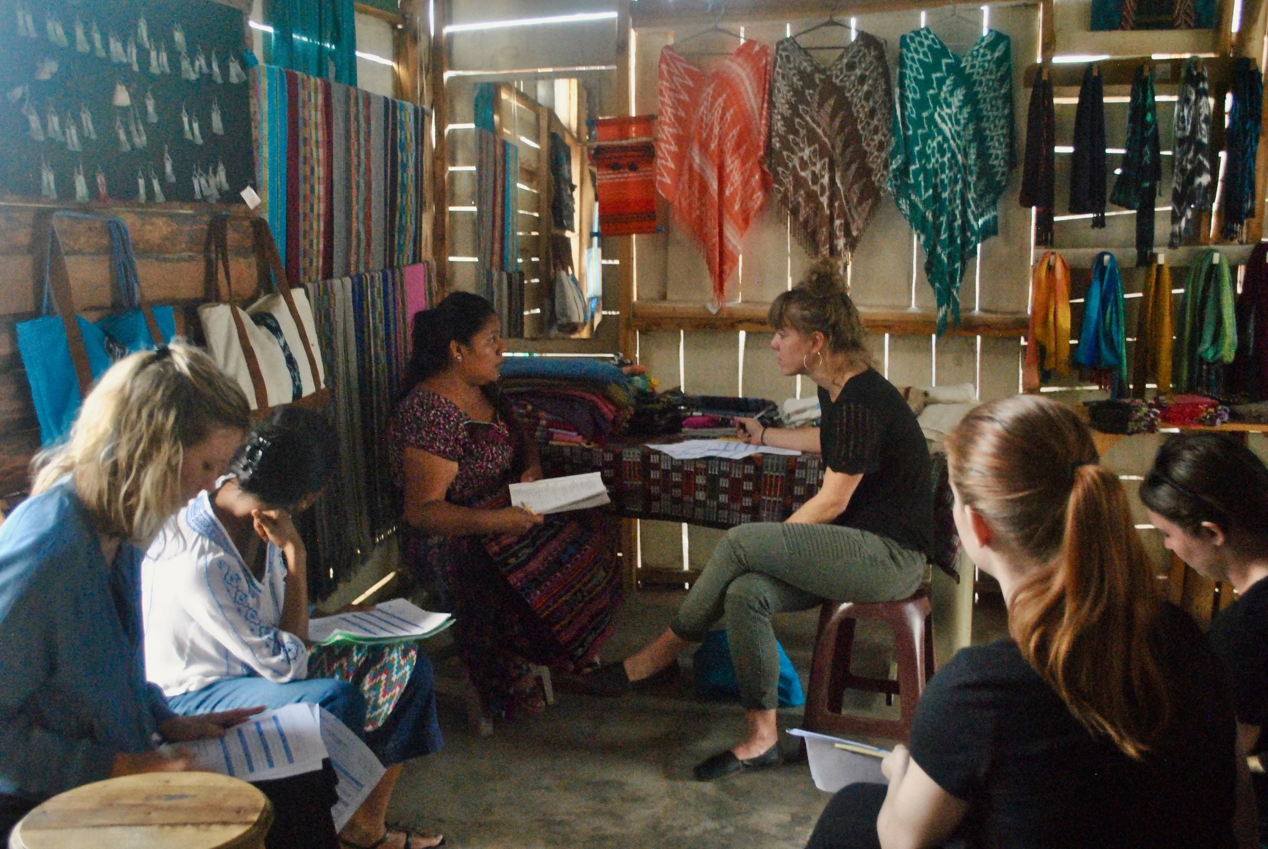 Amanda Zehner (Founder & CEO) and Amalia (President of our parter cooperative) going over translator schedules for interviews.