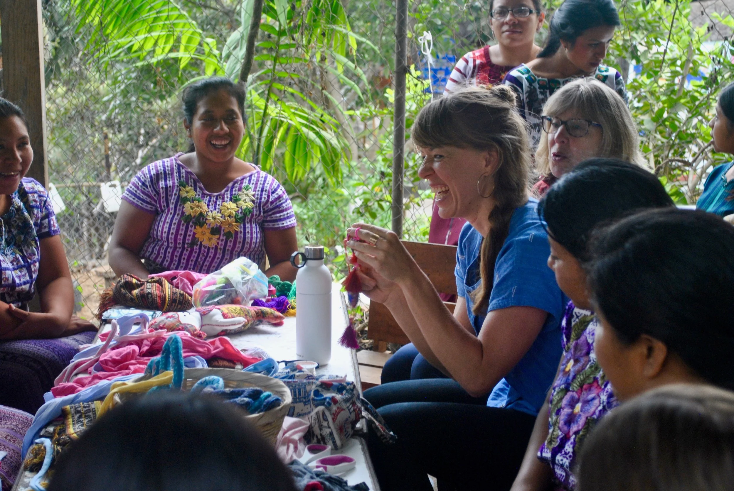 Amanda Zehner (Founder & CEO) sitting down with the Mother Artisan Group at La Puerta Abierta Learning Center.