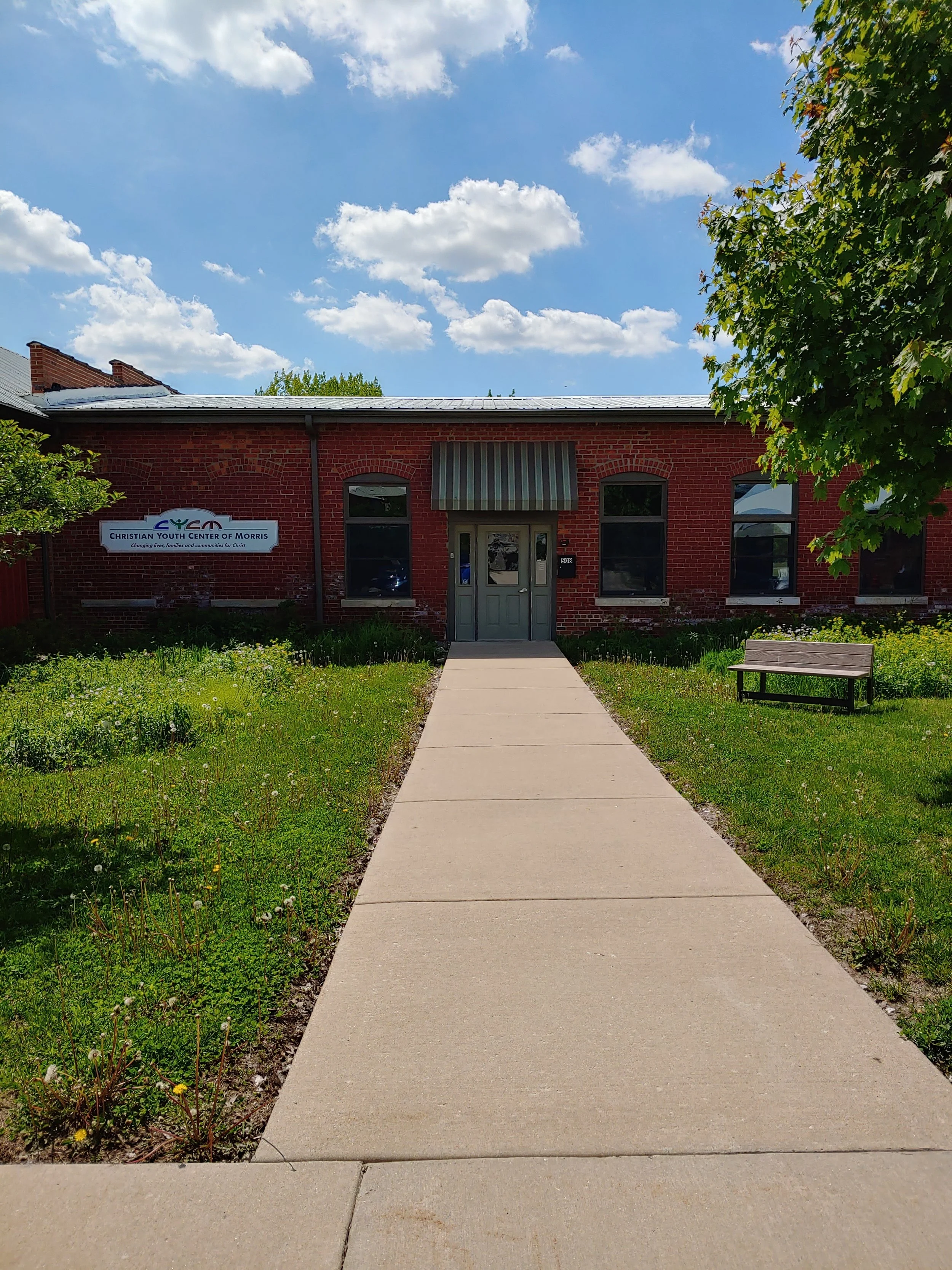The front entrance of the CYCM is located in the Canal Port Community Center at the West end of Illinois Avenue in Morris, Illinois.
