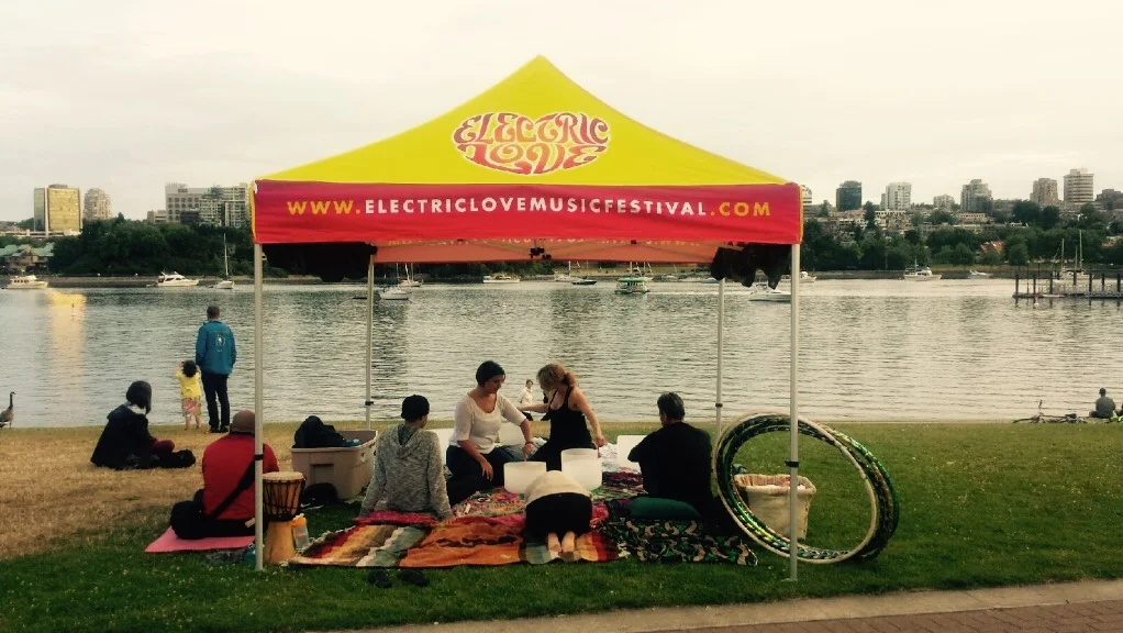 Electric Love's DJ Myshell practices a healing crystal bowl "soundbath" at David Lam park.