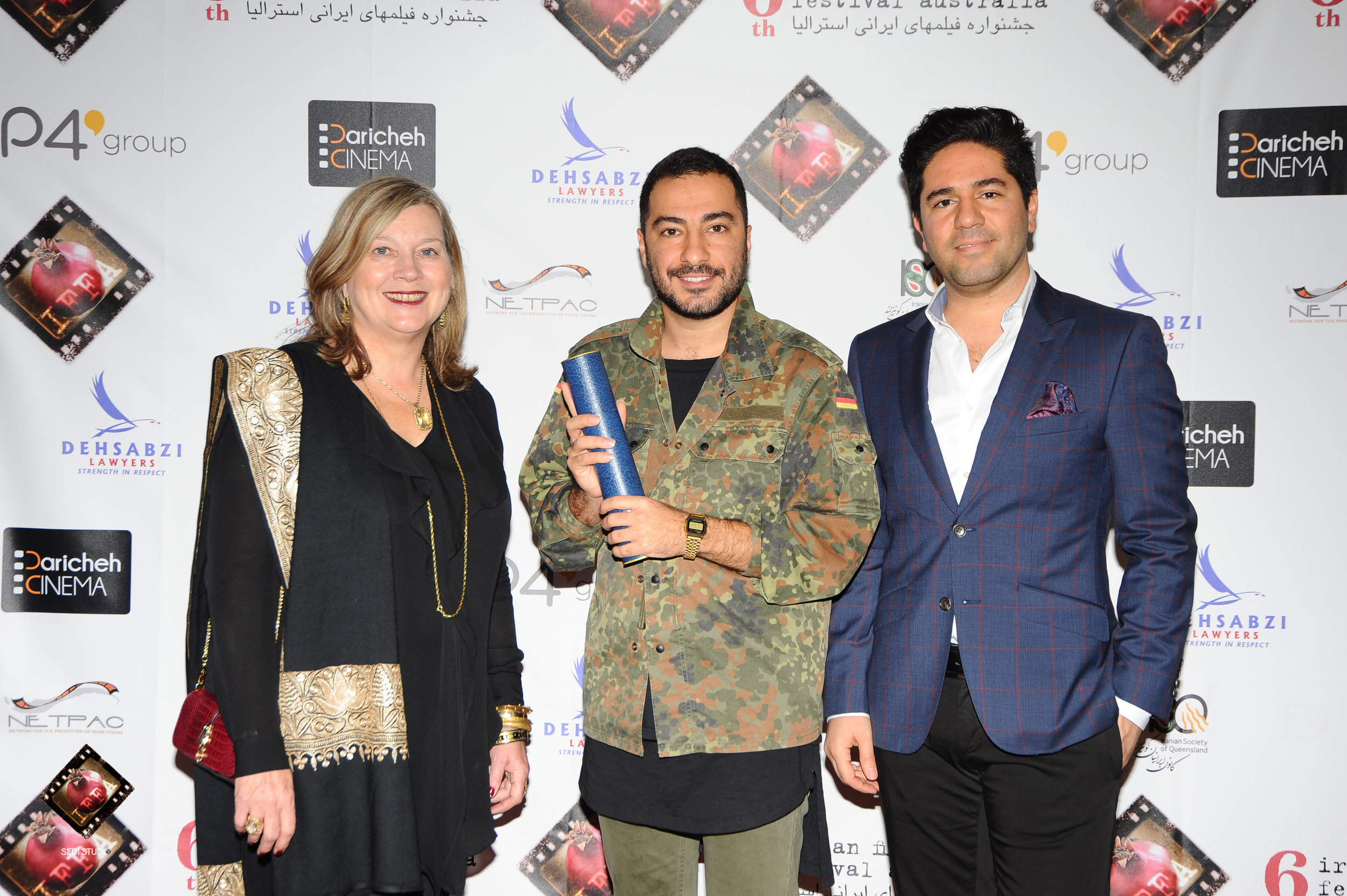 Actor Navid Mohammadzadeh accepting on behalf of Saeed Roostaee