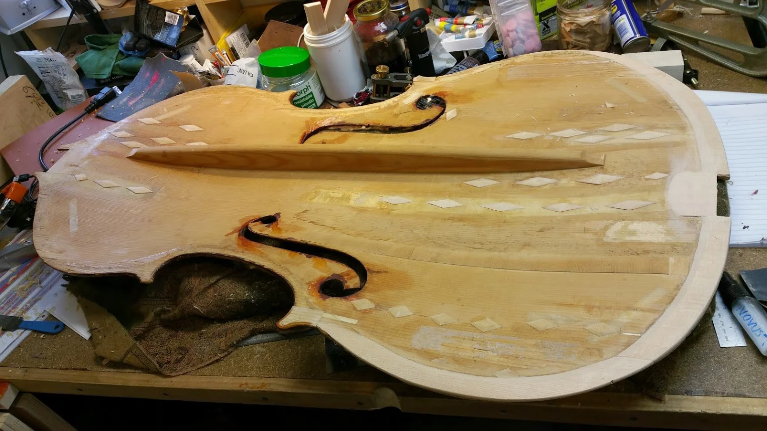 All the canvas has been replaced with wood, and a partial edge doubling put in place to make the edges more stable and to help keep this bass alive for many more years!