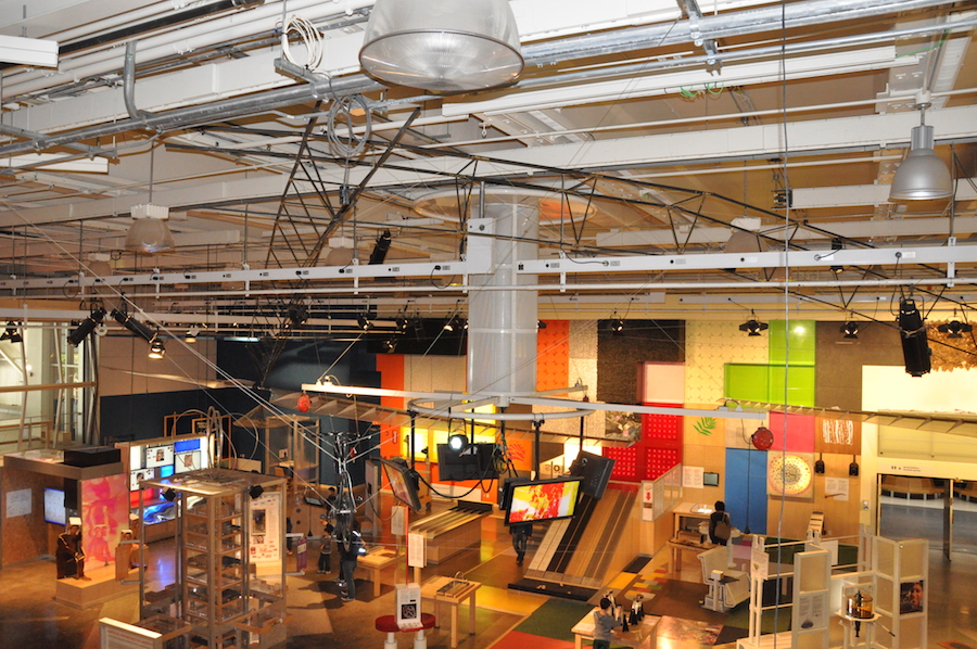 The trusses and hanging bike frame are hard to pick out among the mechanical features of the hall: that’s because there’s helicopter everywhere! (Photo by the Ontario Science Centre)