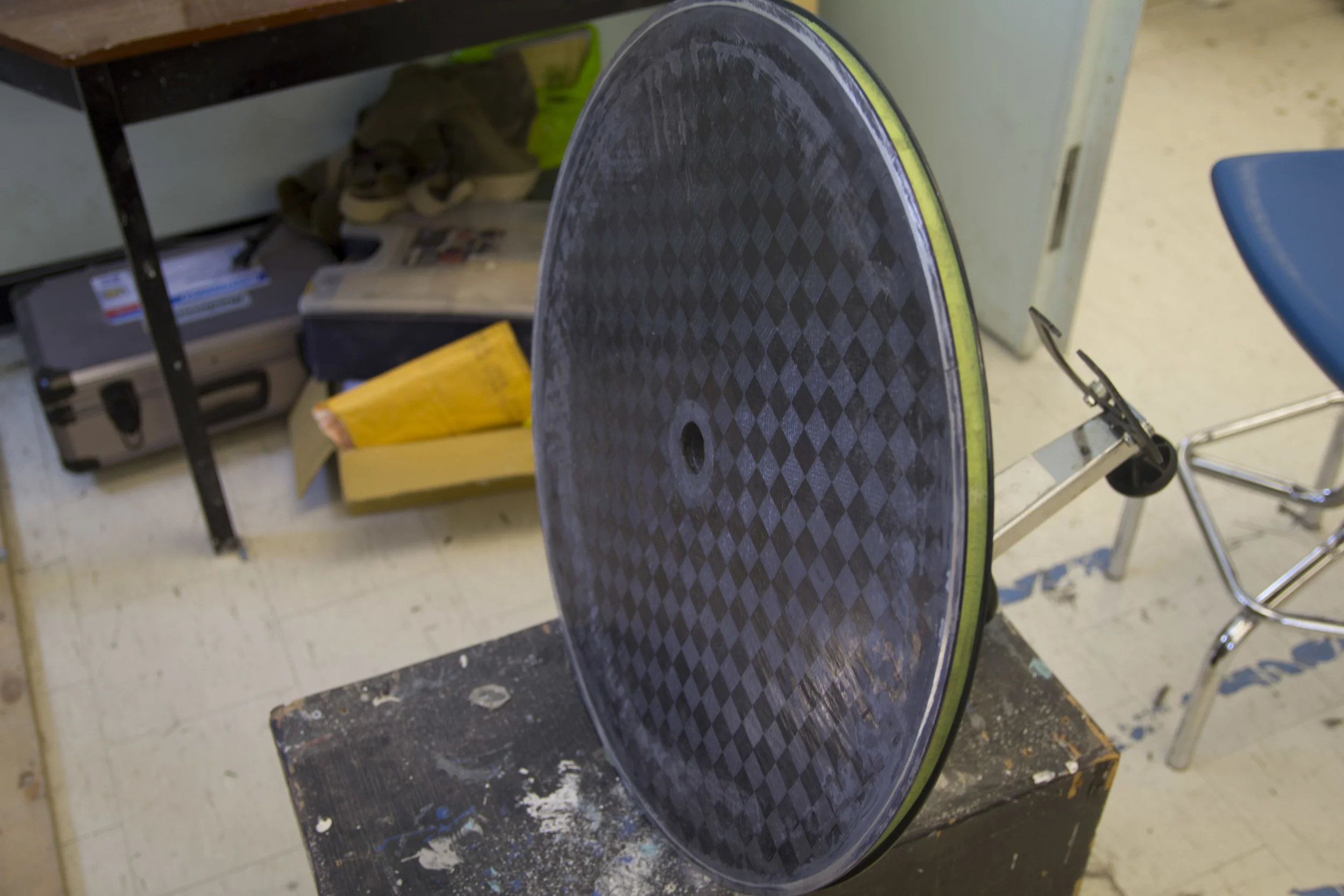 Disk wheel with bonded rim, ready for hub installation and truing.