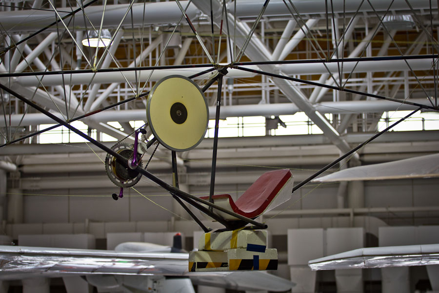 Pilot's seat hung from the truss with carbon tubes and bracing wire on the sides.