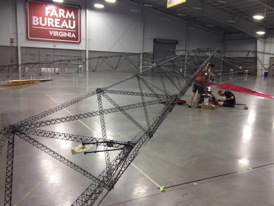 Gamera”s cantilevered truss-arms are comprised of “micro-trusses”. This is an incredibly effective method of getting additional buckling resistance out of carbon fiber composites.