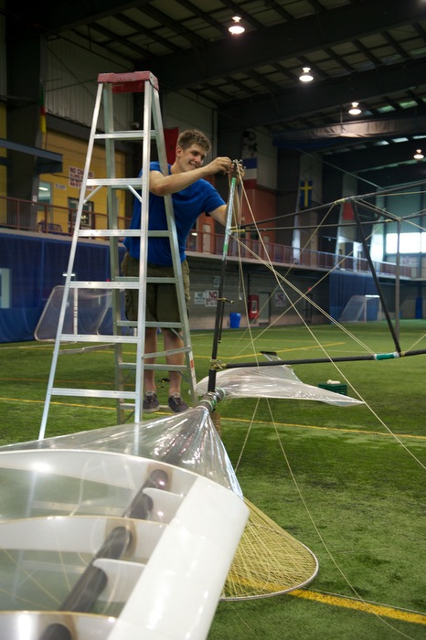Aidan attaches the Vectran bracing lines to the top of one of the truss arms (photo credit Mike Campbell/ckmmphotgraphic)