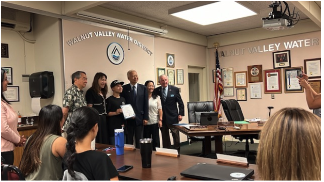 Image of a student being recognized in the community