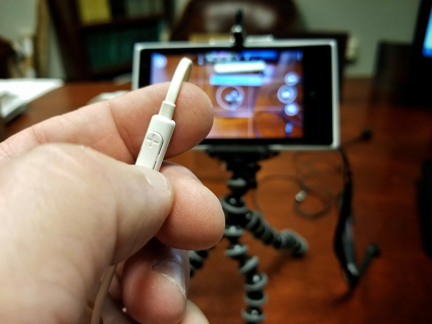 Your earbuds can be used to trigger the shutter by pressing the volume control on them. This reduced camera shake from touching the screen.