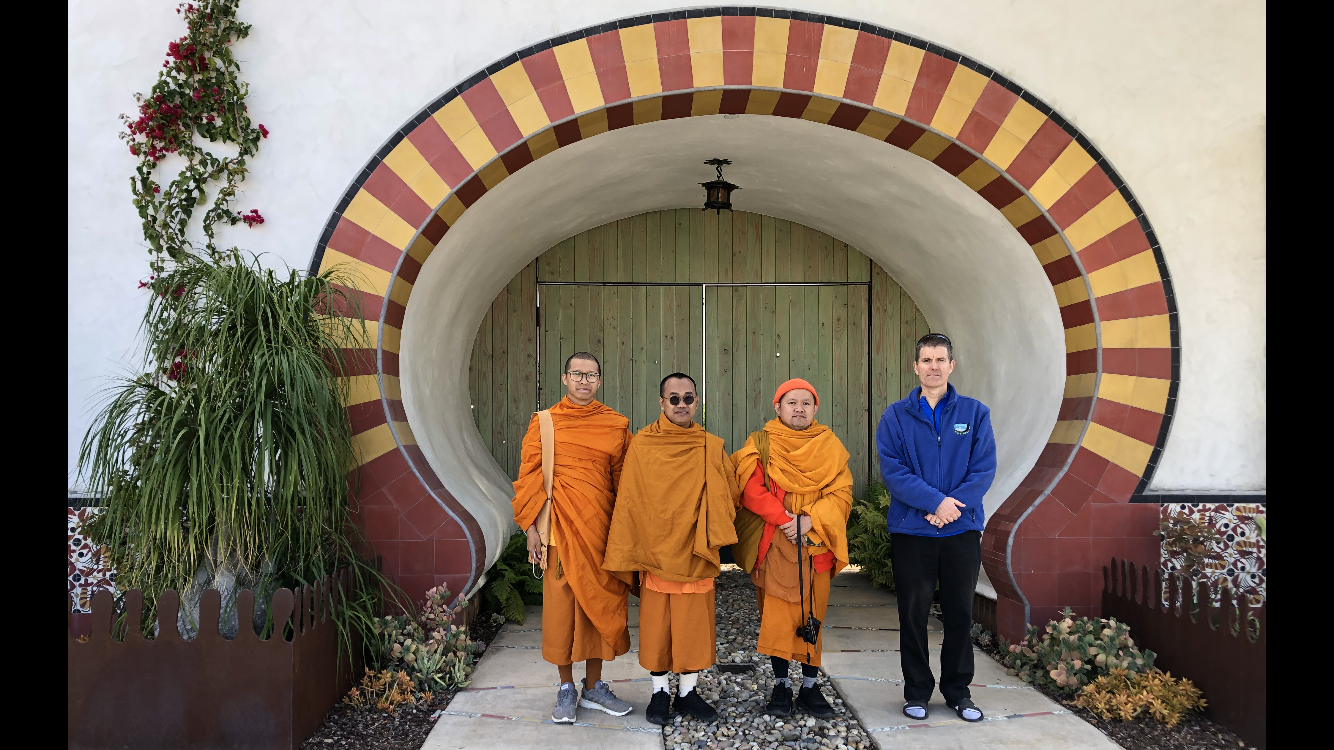 The monks (L-to-R: Ajahn Saran, Ajahn Khamjan and Ajahn Sungworn—and Courtney) during a walking tour of downtown Santa Barbara.