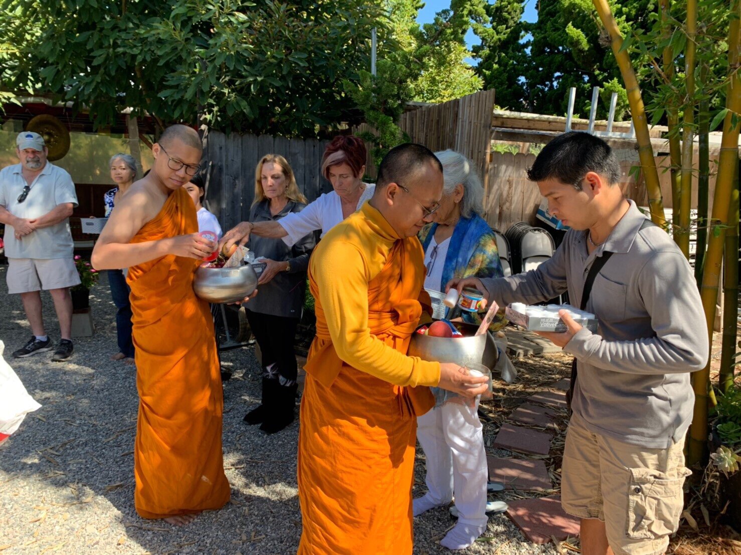 Community members offering alms to the monks on September 21, 2019