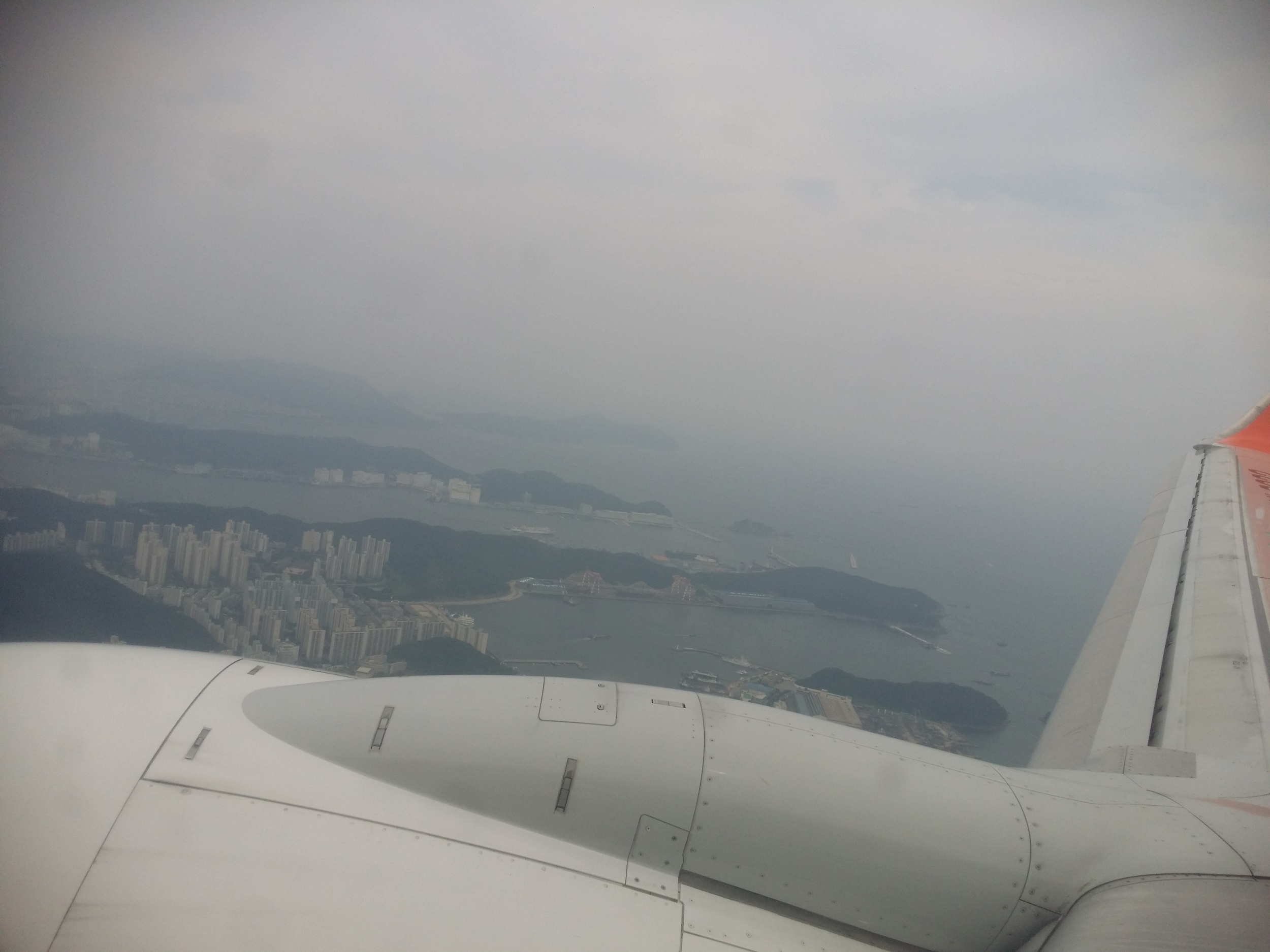 Flying with Jeju Air over a cloudy Korea