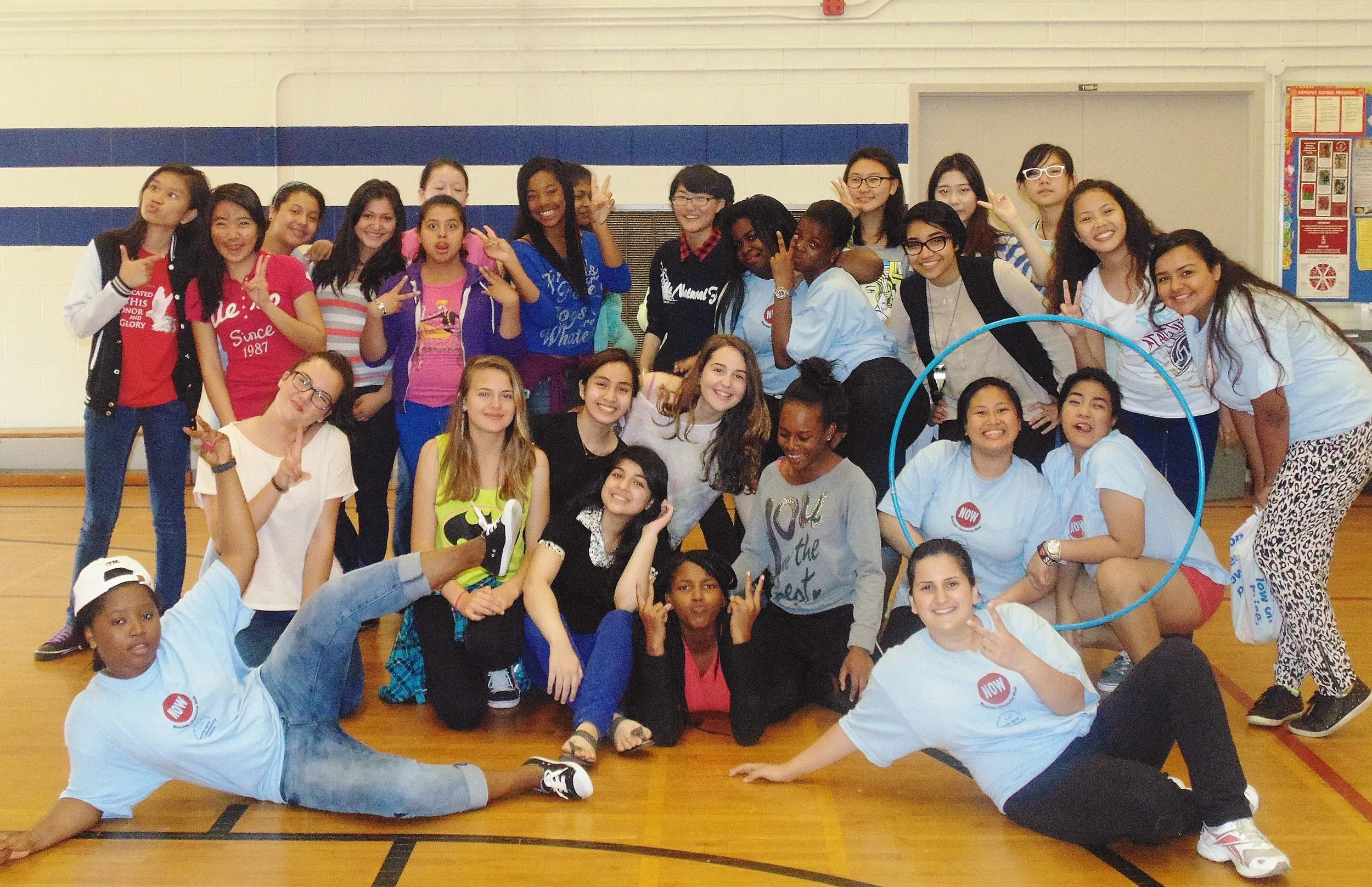 Newcomer students gather at a special girls-only Newcomer Orientation Week at Madonna Catholic Secondary School. Photo by Nora Youkhana.