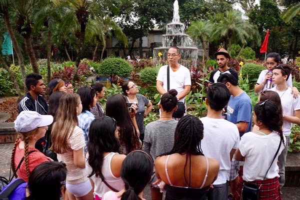 Consul's father Bernie gives students a Philippine history lesson at Fort Santiago. Photo by Catholic Student Leadership