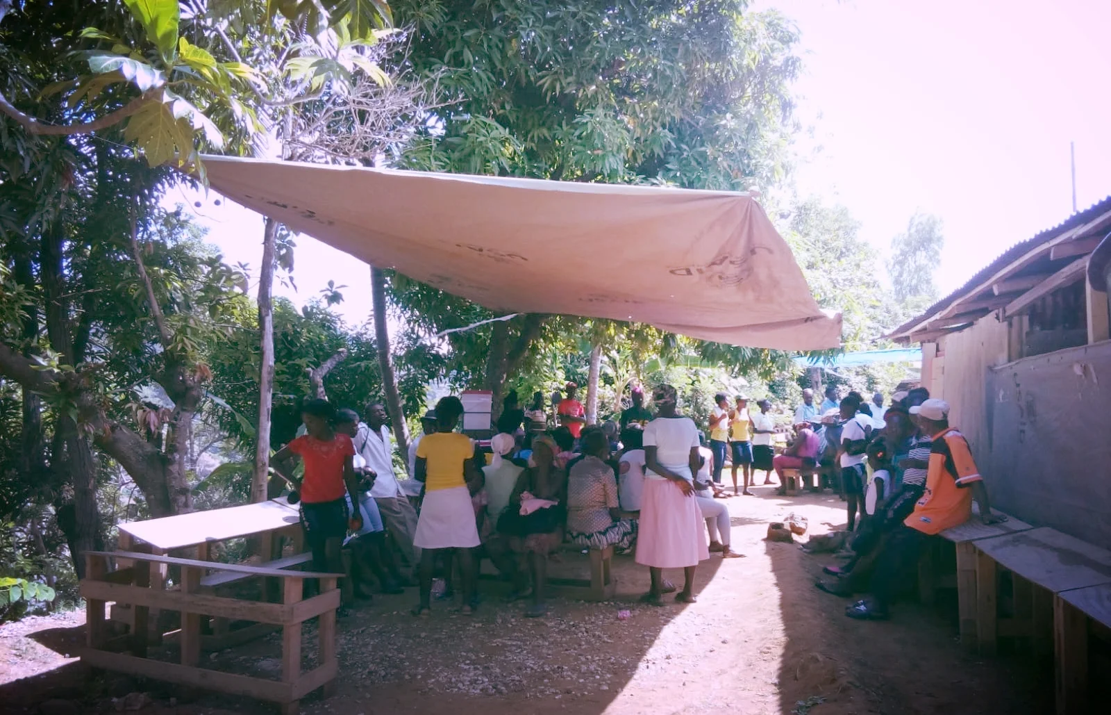 Community members wait for a consultation at a mobile clinic in the mountains of Leogane. For many, attending this mobile clinic is their sole access to healthcare.
