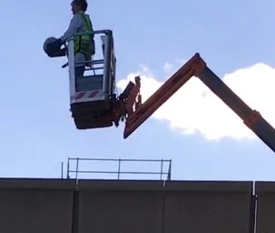 SPS member David Perryman prepares to toss a pumpkin from a 60 ft high cherrypicker