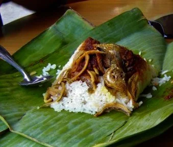 Homemade lunches wrapped in banana leaves