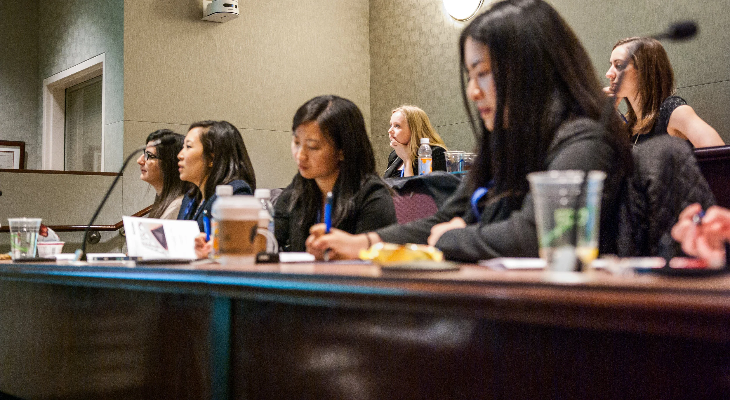 attendees taking notes