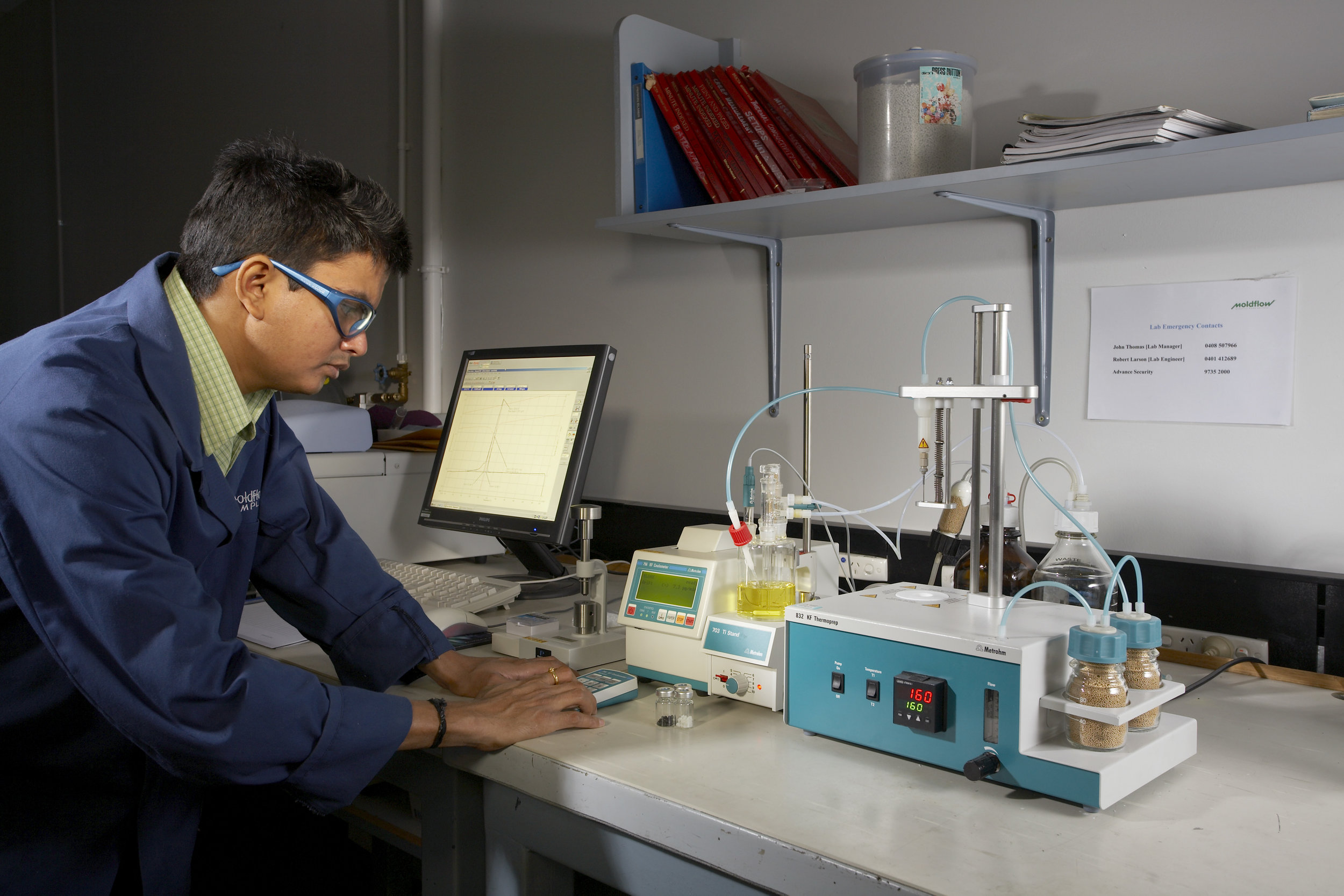 Tech in the Moldflow lab using a Metrohm 756 KF coulometer (left) to measure the moisture content of raw plastic materials. On the rights is a Metrohm 832 KF thermoprep, which heats material in a hermetically sealed vessel.