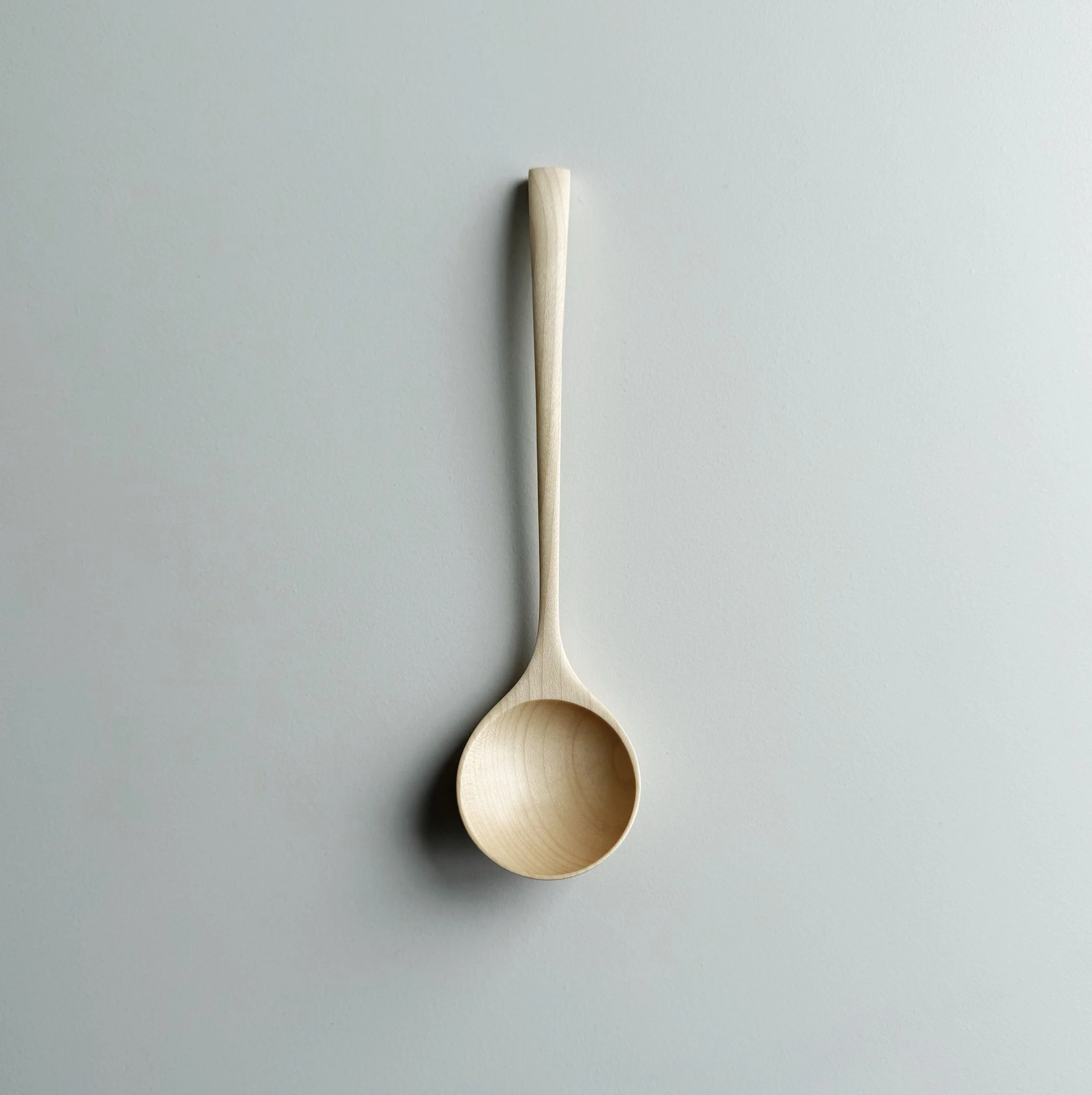 Angled eating spoon in sycamore