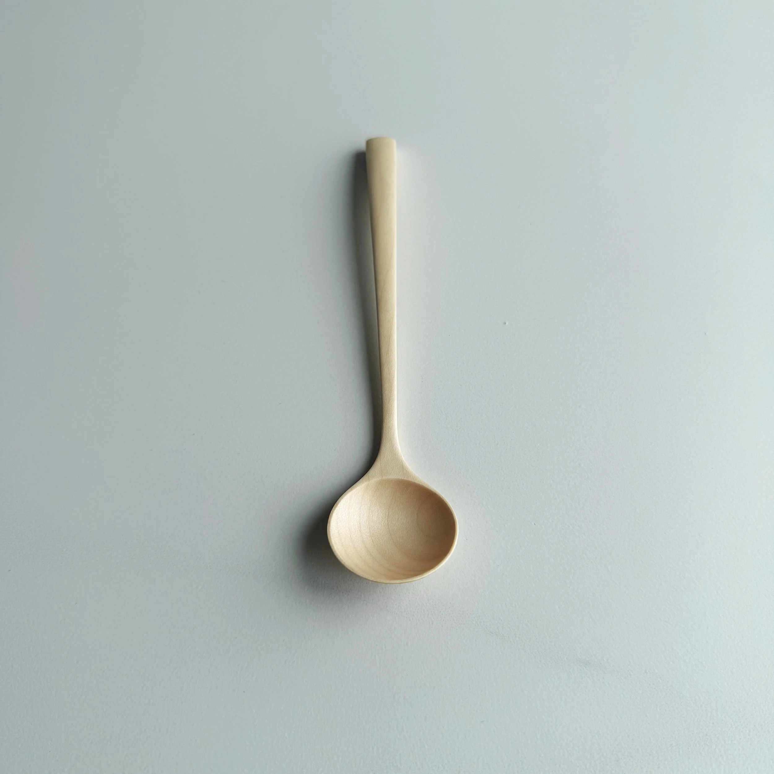 Small angled eating spoon in sycamore