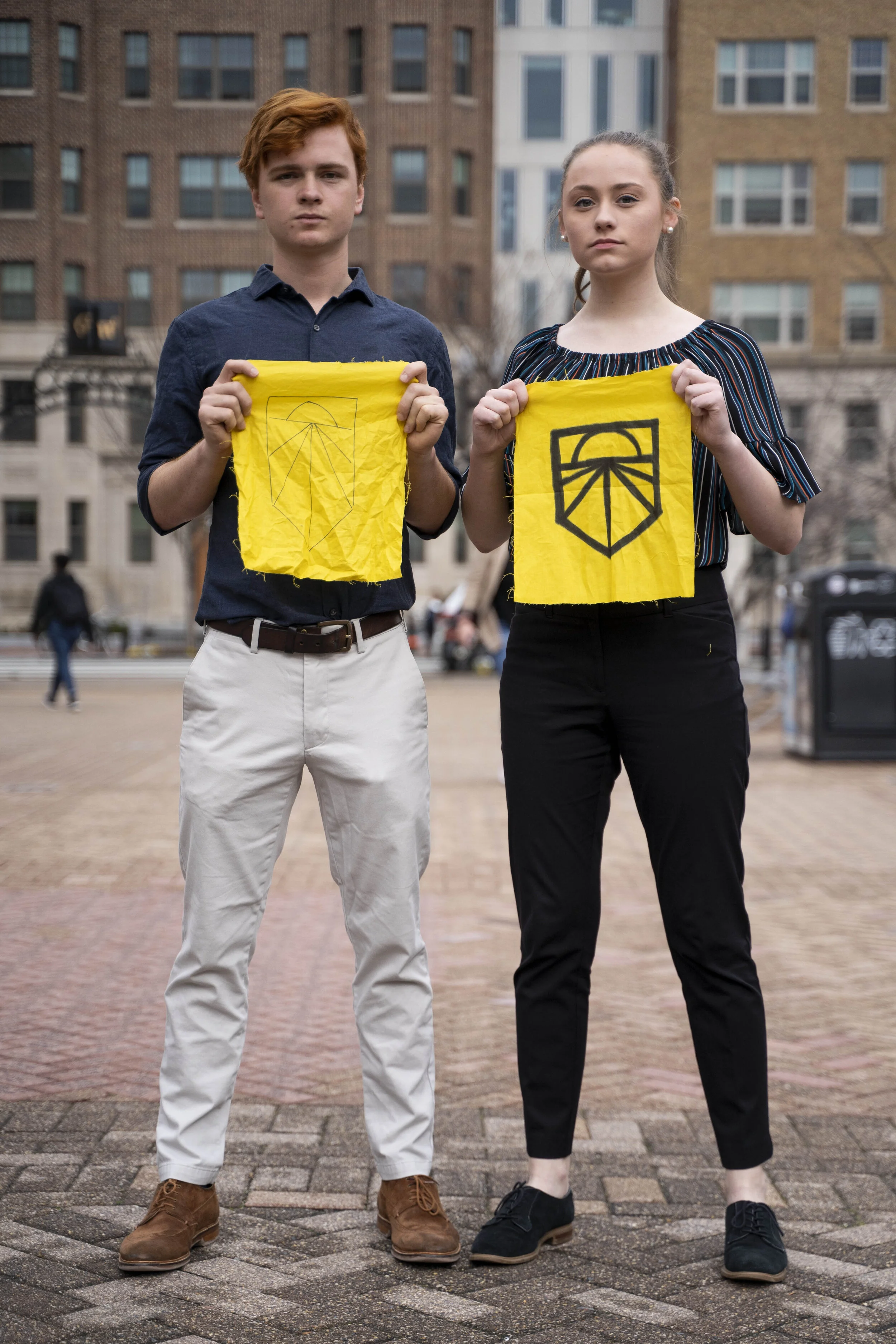 Joe Markus (left) and Sophia Halloran (right) pose in Kogan Plaza after a protest committed to divesting fossil fuels from GWU on February 4, 2020.