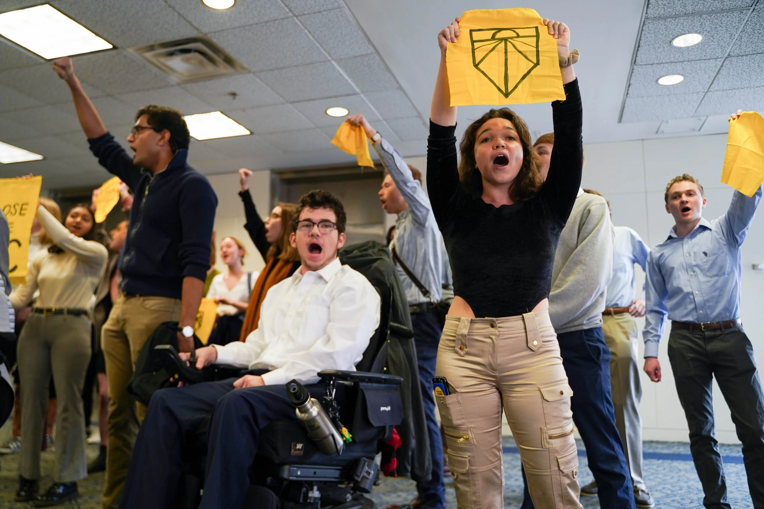Student’s from Sunrise GW exit a protest in the Marvin Center. They infiltrated a GWU investors meeting, and organized a protest to demand the university divest from fossil fuel investment on February 4, 2020.