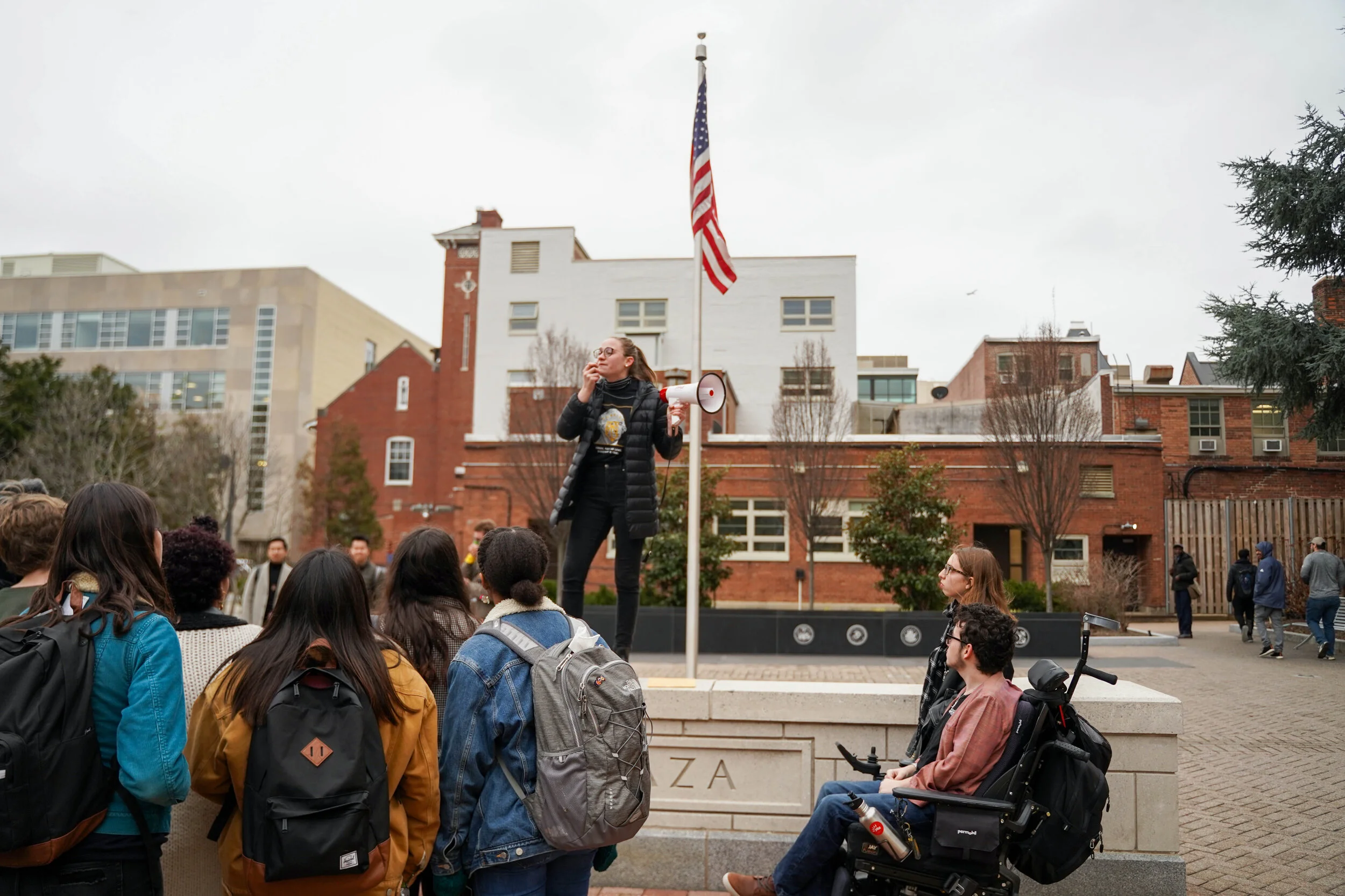 Sophia Halloran of Sunrise GW leads a chant in Kogan Plaza on February 5, 2020 to protest GWU’s fossil fuel investments.