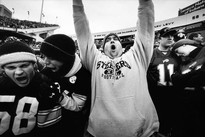      

 
  Fans from both teams react to a James Harrison fumble returned for a touchdown.
Ralph Wilson Stadium, Buffalo, NY 2005. [XVI04A417R08]
 






















     