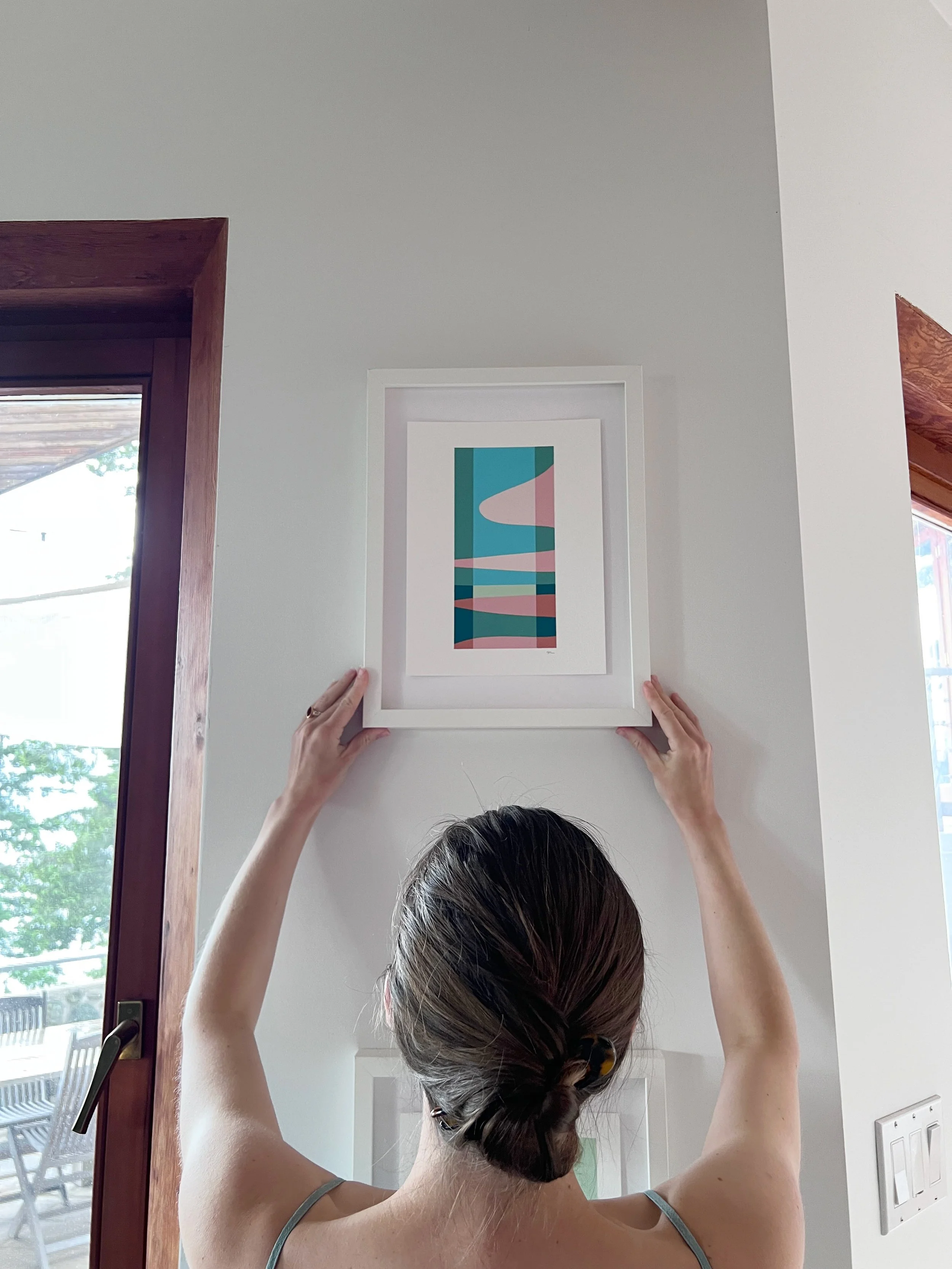 Here&rsquo;s a shot from when @roz_massey and I were trying to hang this painting straight without a level. I think we nailed it 🤣🥰
