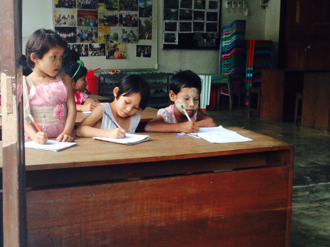 Uki sitting in the front of her class