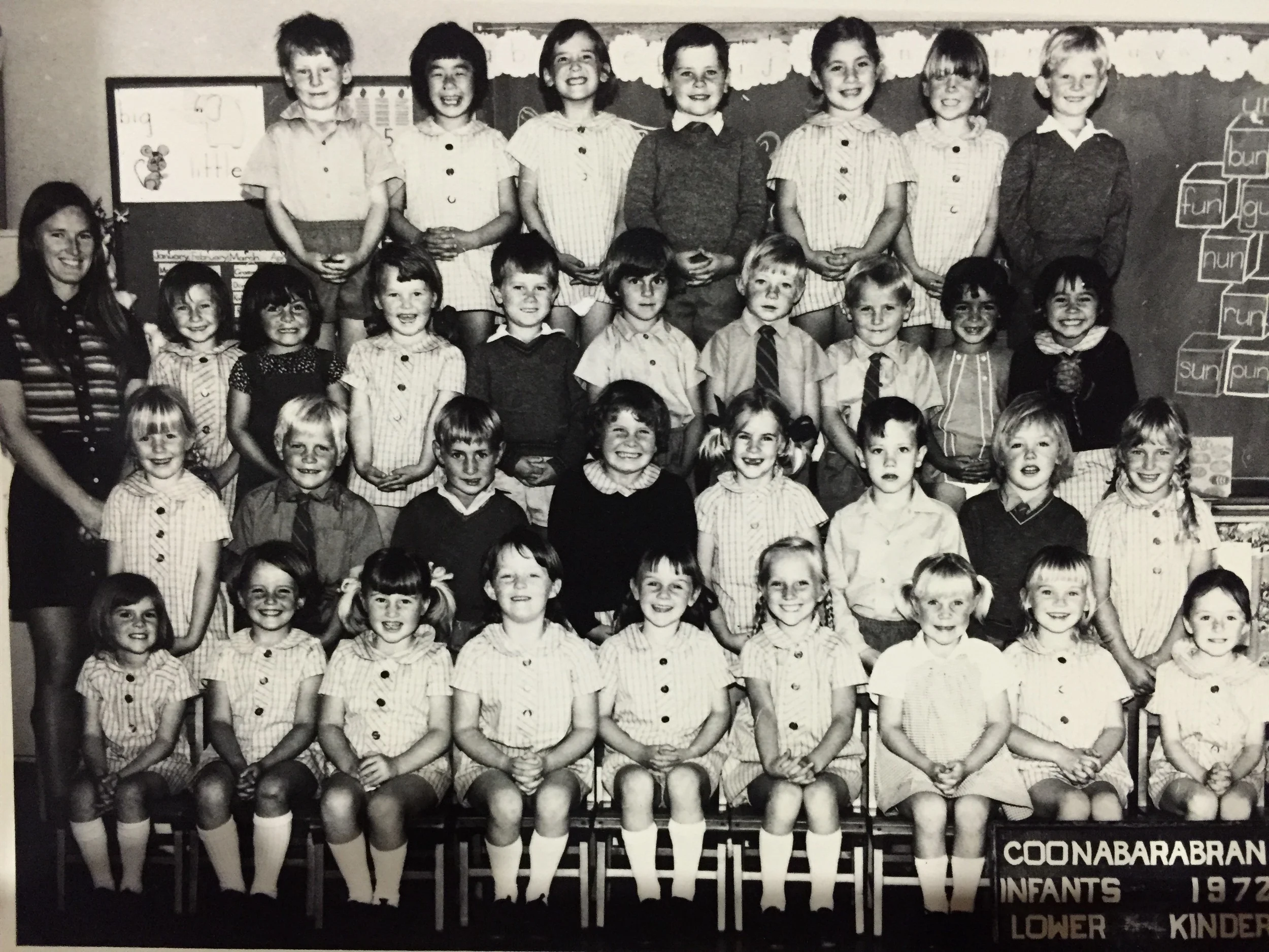 I'm afraid the black and white photo does NOT do justice to her extreme passion for colour co-ordination. I'm the girl with plaits, second row, far right.