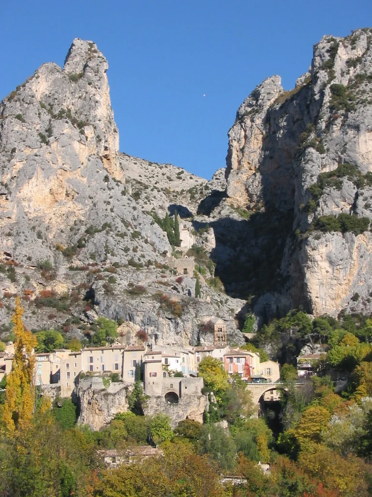 Moustiers-Sainte-Marie, a delightful village tucked away at the base of the mountains. You can see the chapel perched high above the town.