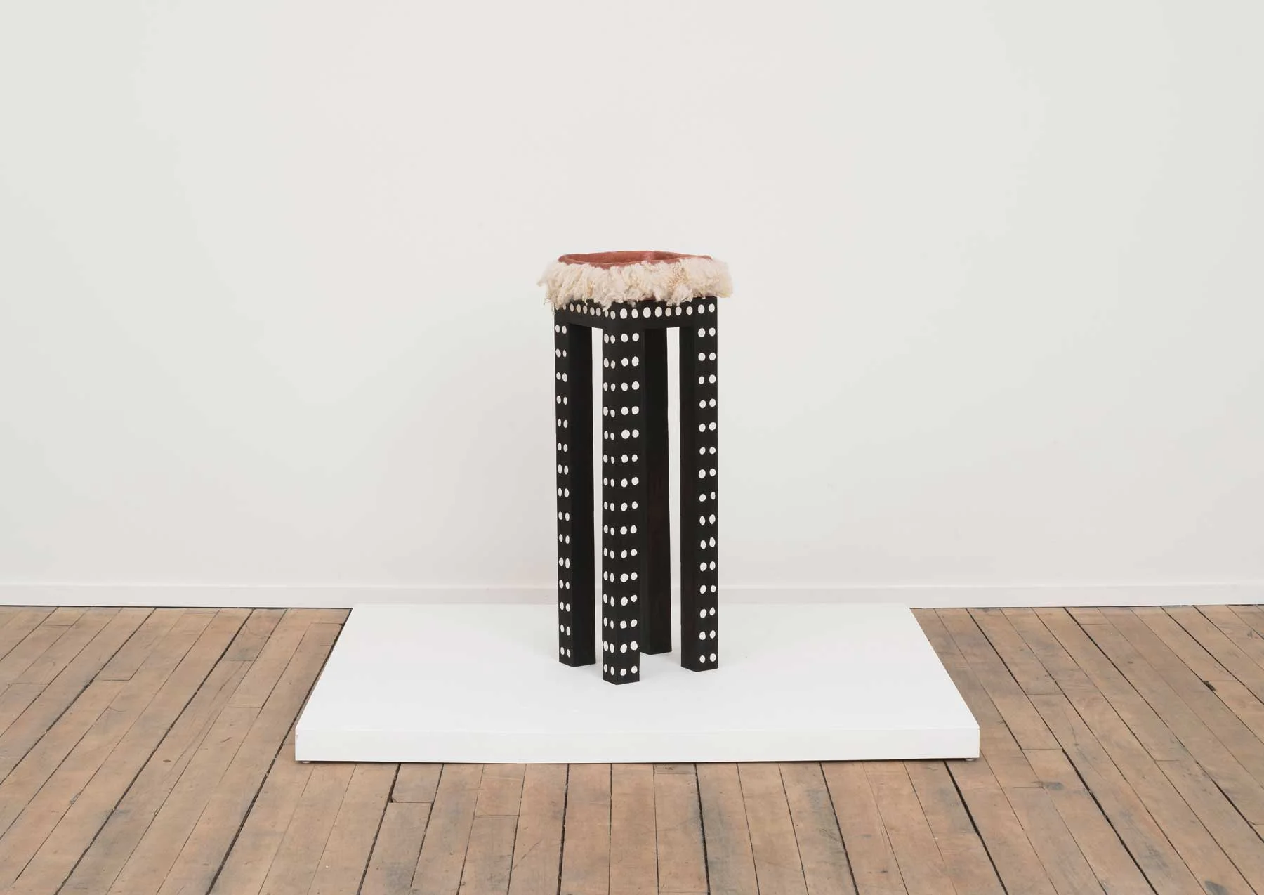 Soothe Table (Provide) , 2015 Charred poplar, self-drying clay, terra-cotta, wool 10 x 10 x 35.5 inches Image courtesy of Volume Gallery, Chicago, IL