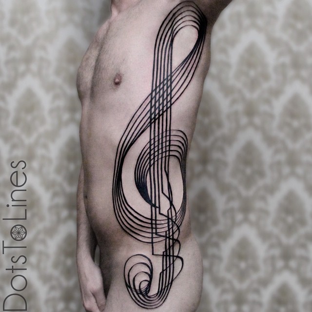 Body-Side-Blackwork-Treble-Clef-tattoo-by-Chaim-Machlev.jpg
