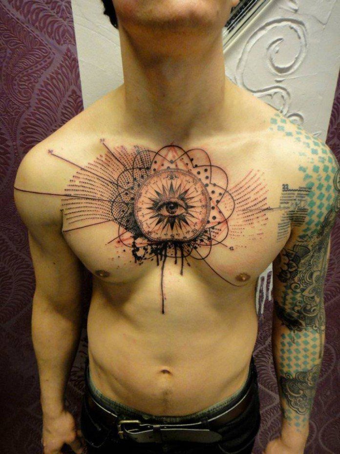 A-human-eye-stares-out-from-a-mandala-on-this-guys-chest-in-an-abstract-tattoo-by-Xoil-696x928.jpg