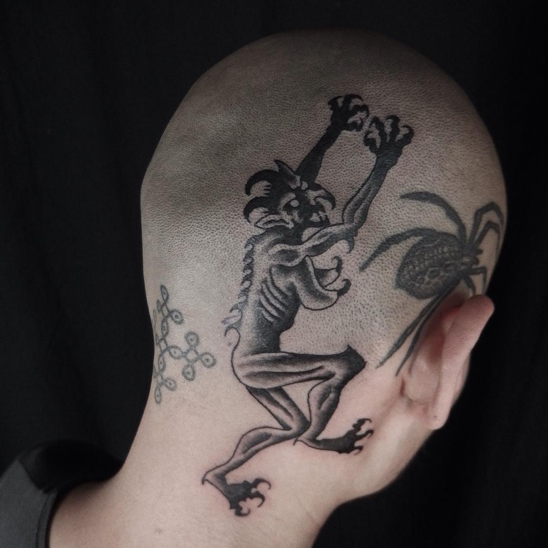 Back-of-Head-Tattoo-by-Rafel-Delalande.jpg