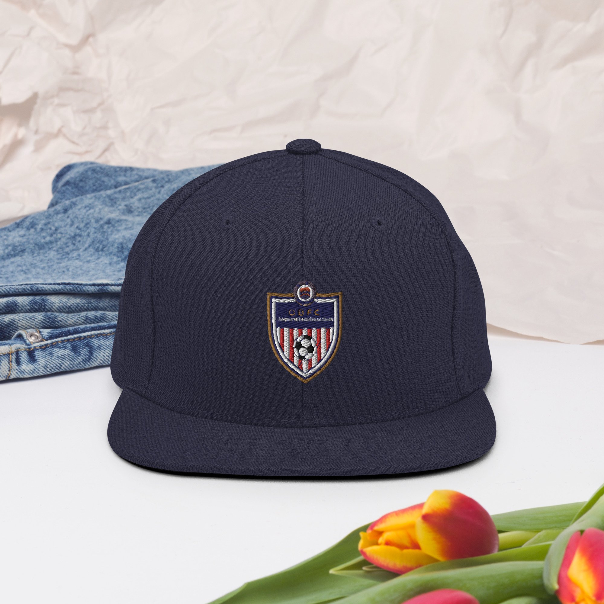 classic-snapback-navy-front-2-63c8ee3318cce.jpg