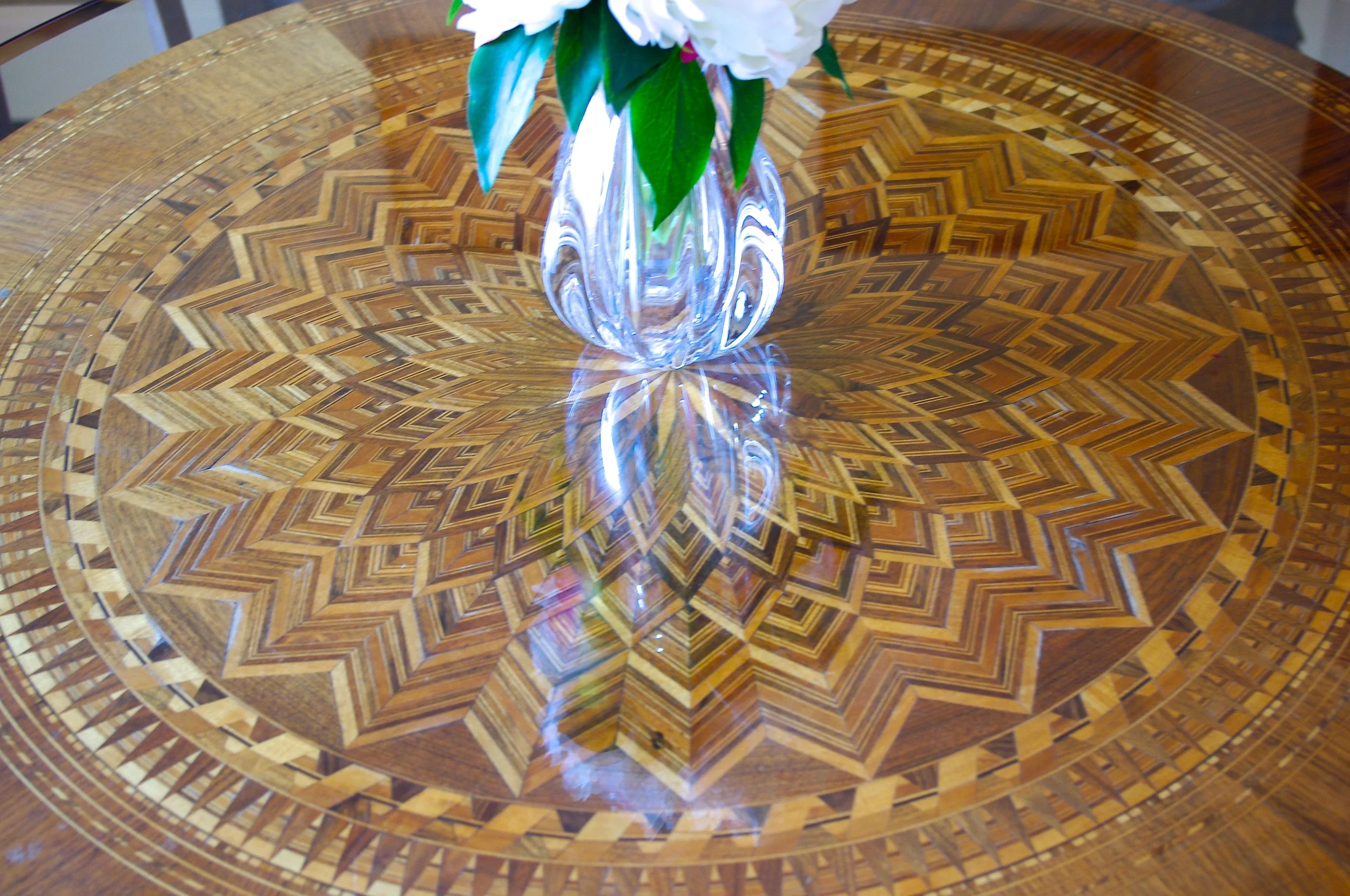 Ann's mother's antique table topped with new glass makes the perfect dining table in a small room