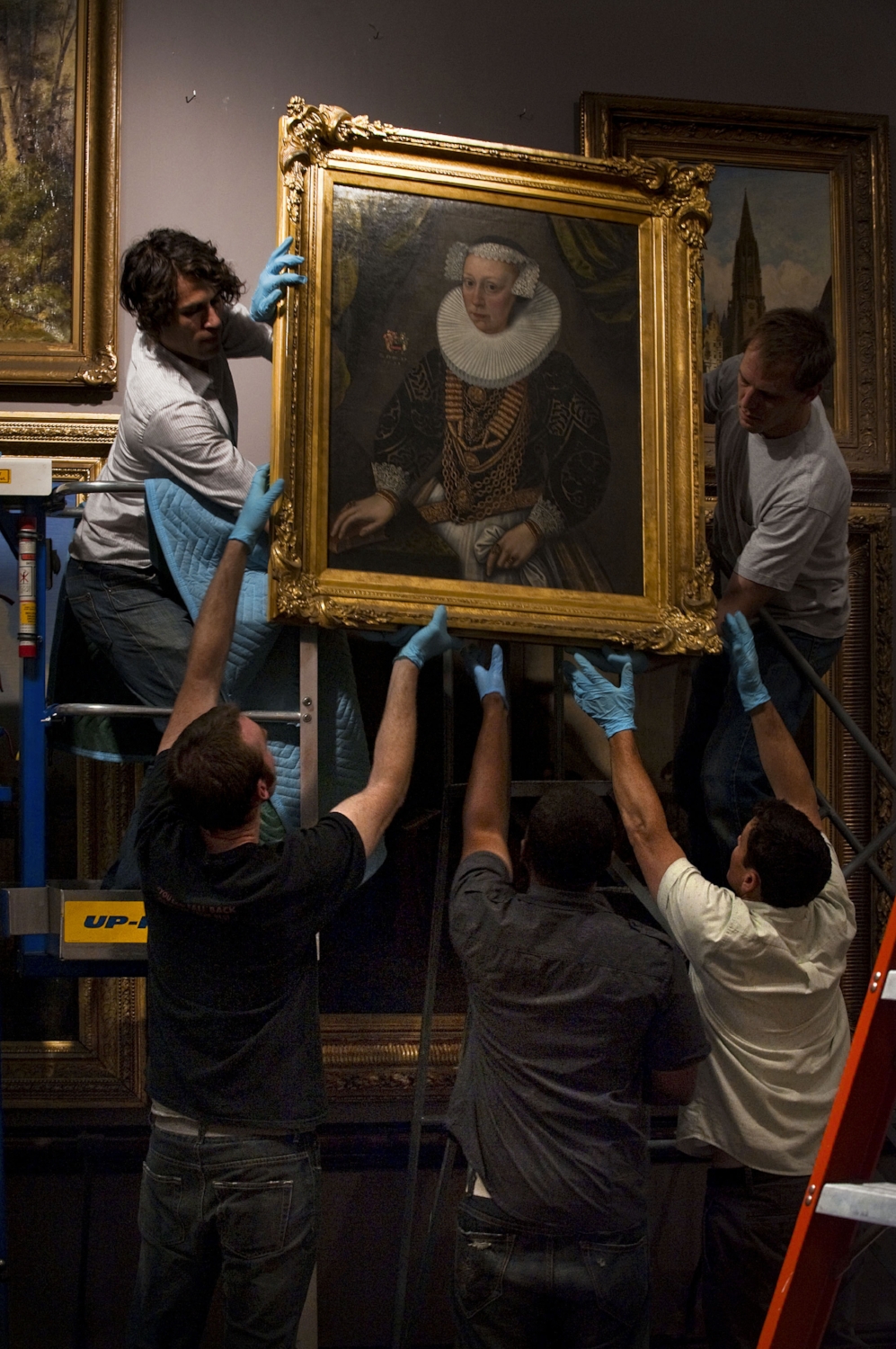  Exhibition technicians remove artwork from the California Gallery at the Crocker Art Museum in Sacramento on Thursday, June 10, 2010. 