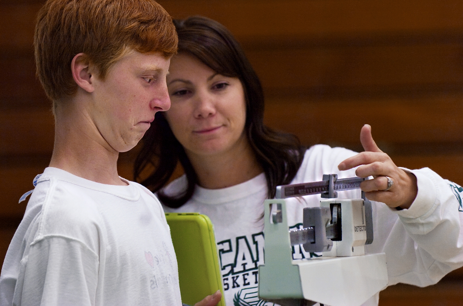  Matt Coulam 15, left, is weighed by PE teacher Cici Robinson during physical fitness testing at El Camino High School in Sacramento on Tuesday April 22, 2008. 